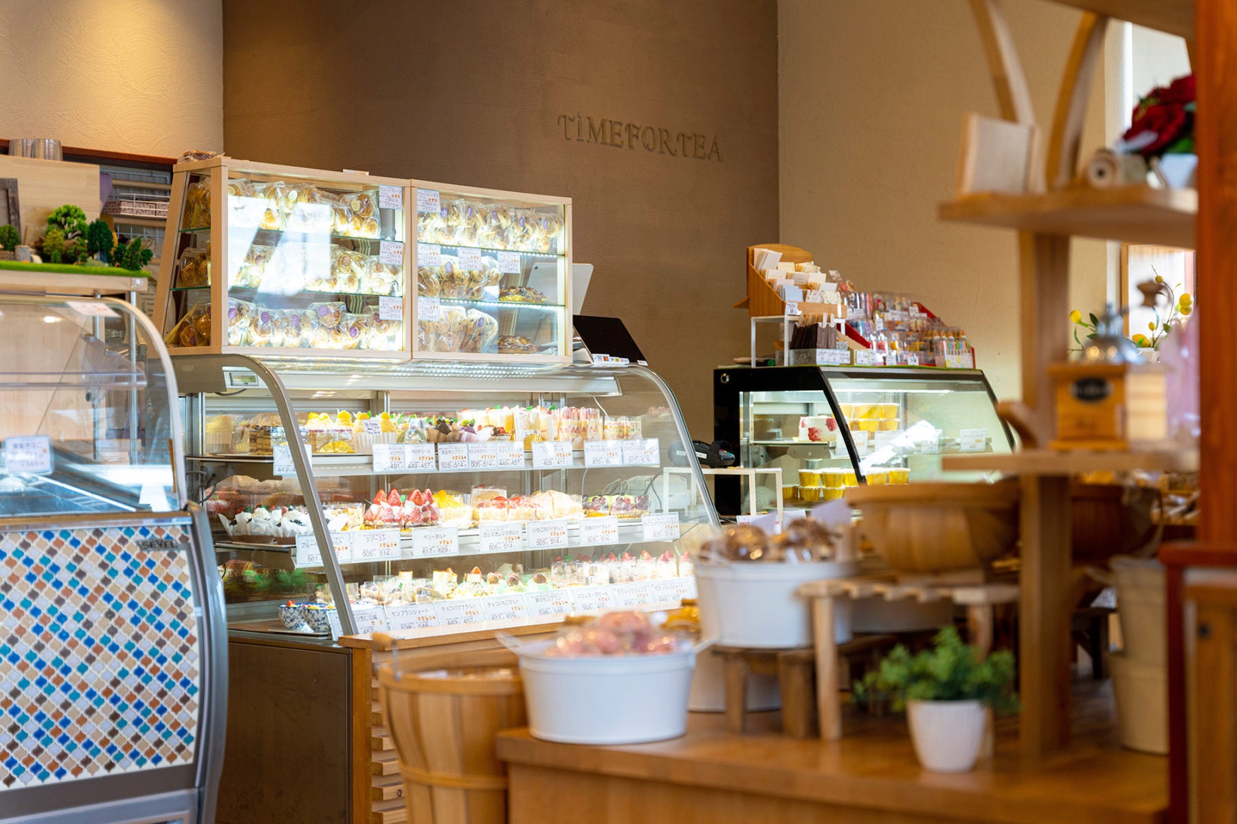 Pastry counter glowing with cakes and breads